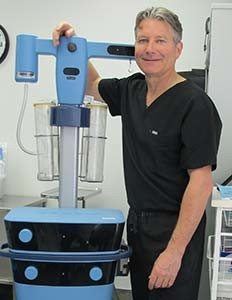 Surgeon demonstrating Vaser gynecomastia treatment