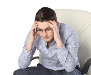 Man with head in hands